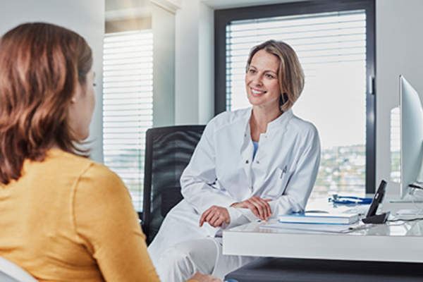 Doctor helping patient find the best treatment.