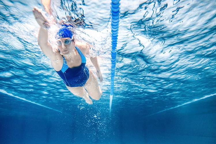 Woman swimming laps.