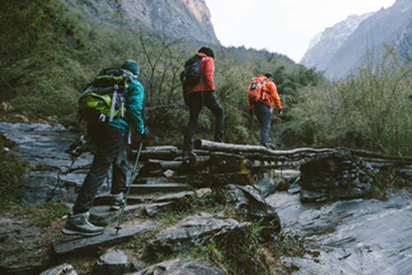 People hiking along a mountain path.