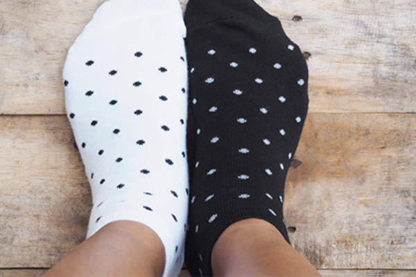 Feet in socks and front of legs.