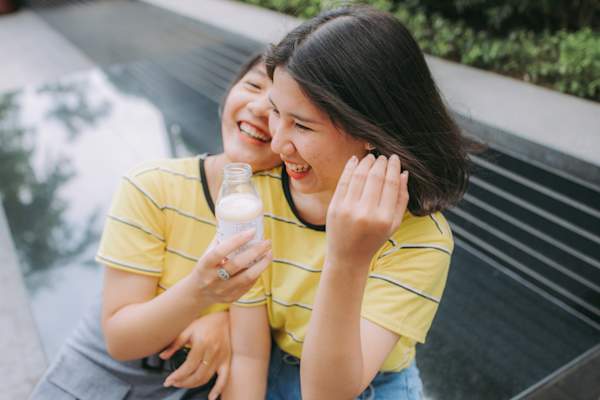 two women laughing together