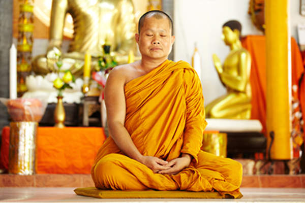 Buddhist monk meditating.
