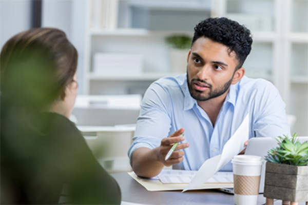 Woman talking to her lawyer.