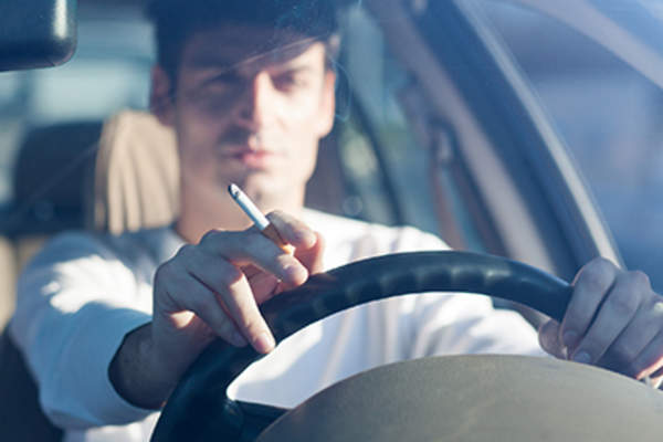 Man smoking while driving.