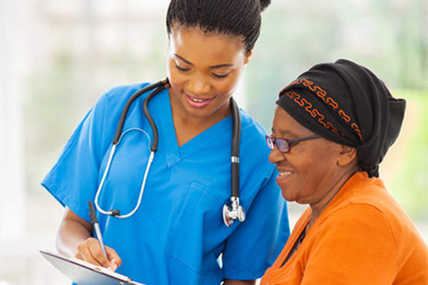 Doctor explaining information to female patient.