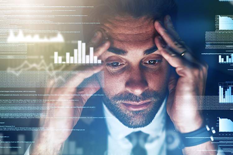 Stressed man working as a computer programmer.