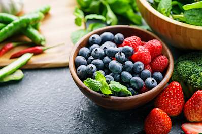 Strawberries, blueberries, and broccoli that are high in flavonoids.