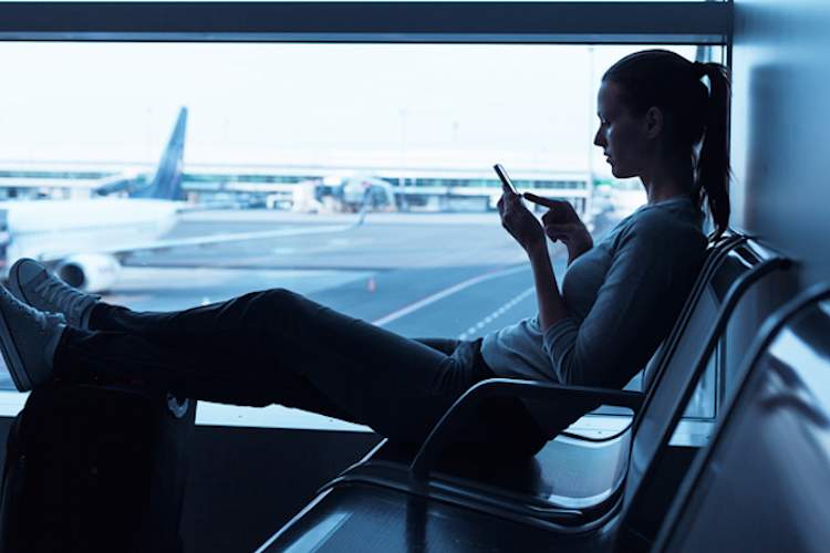 Woman travelling, waiting at airport