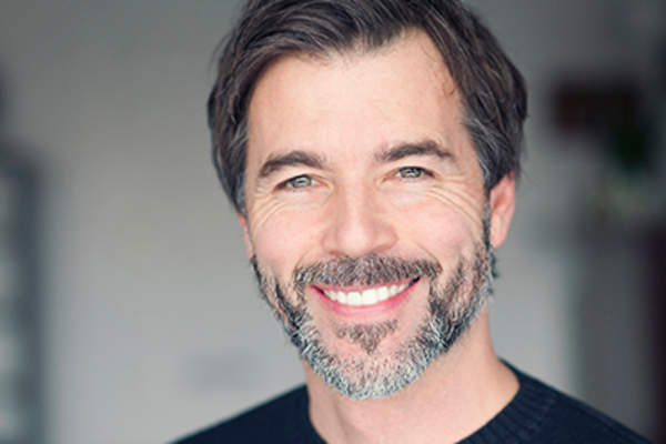 Man with good teeth smiling.