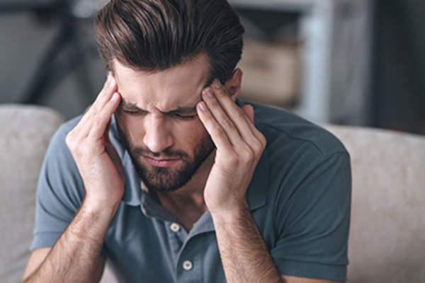 Man with a headache.