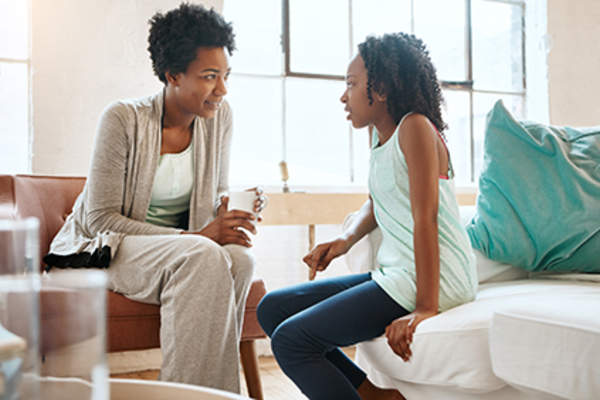 Mother talking to daughter.