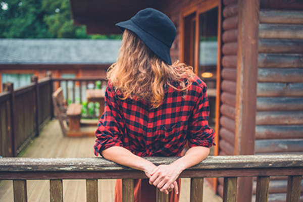 Woman wearing a checkered shirt.