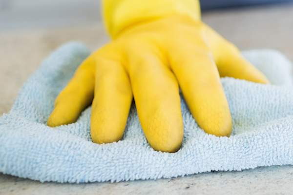 Cleaning with gloves.