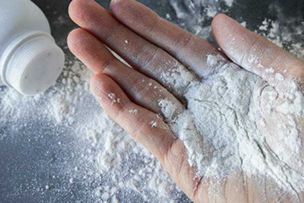 Talcum powder on hands.