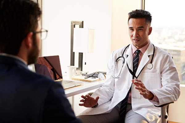 General practitioner explaining information to a patient.