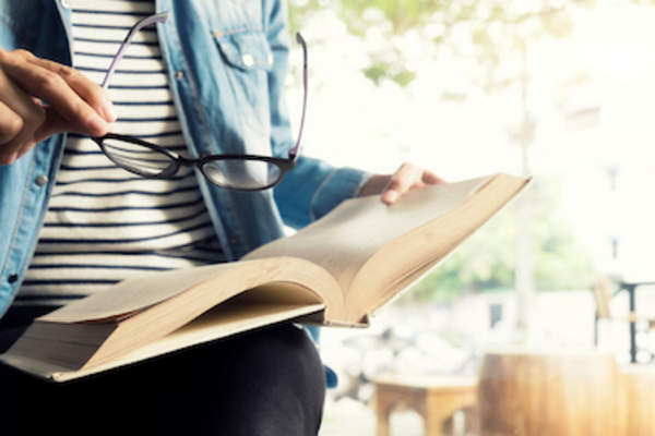 Woman reading medical book.