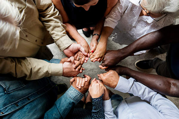 People holding hands.