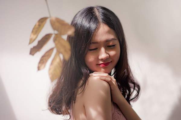 woman touching skin