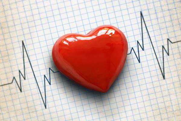 Heart on cardiogram; heart disease concept.