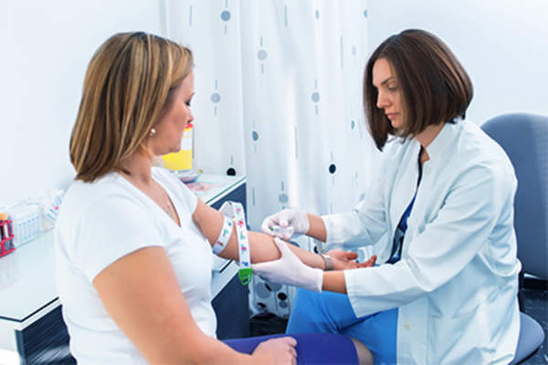 Woman having a blood test.
