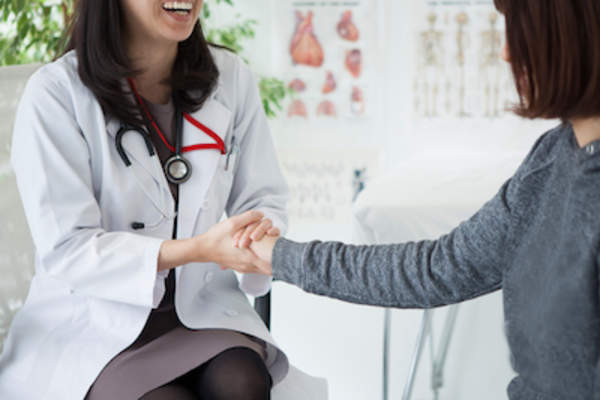 Doctor and female patient talking.