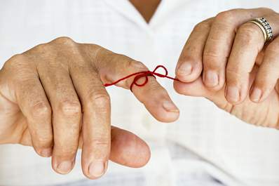Red string Tied on finger