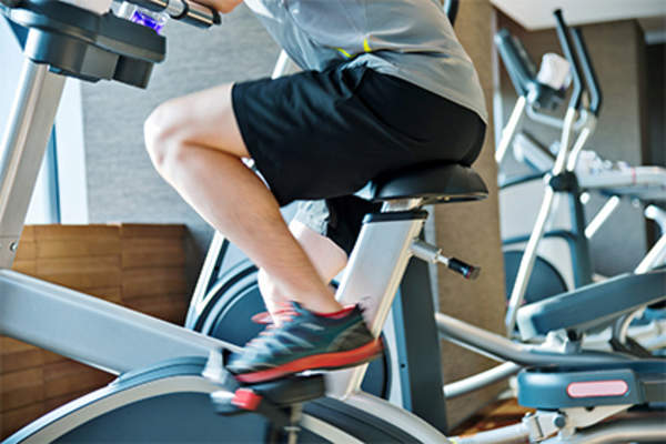 Man on exercise bike.