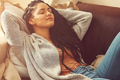Woman napping on couch