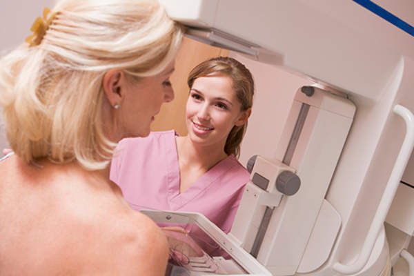 blonde woman having mammogram image