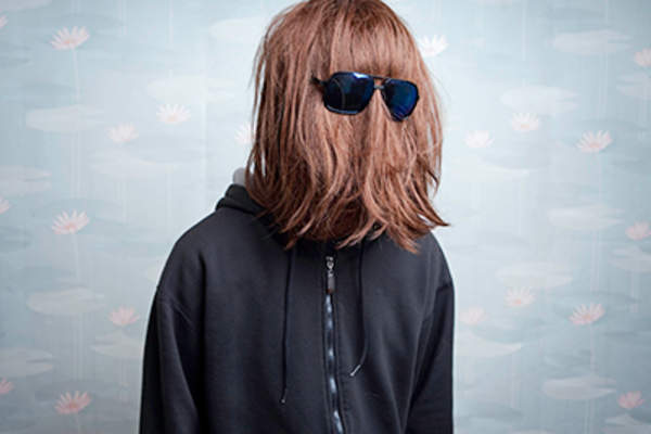 Person covering their face with hair.