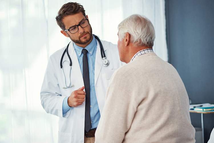 Doctor talking to male patient.
