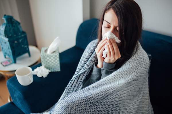 sick woman on couch