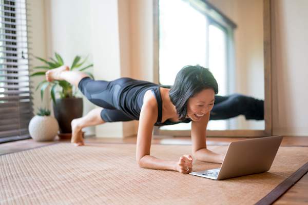 Asian woman exercising at home