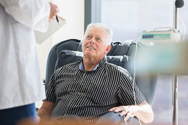 Senior man undergoing chemotherapy treatment for leukemia.