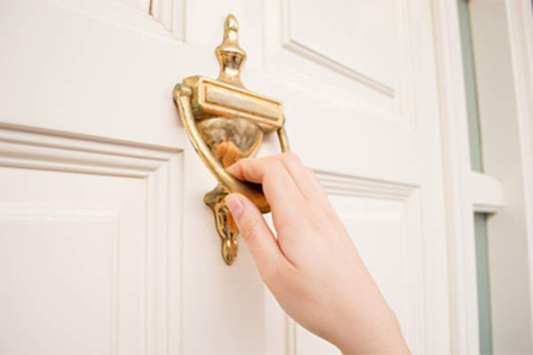 Knocking on the front door.
