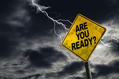 Lighting flashing behind a sign that says "Are You Ready?"