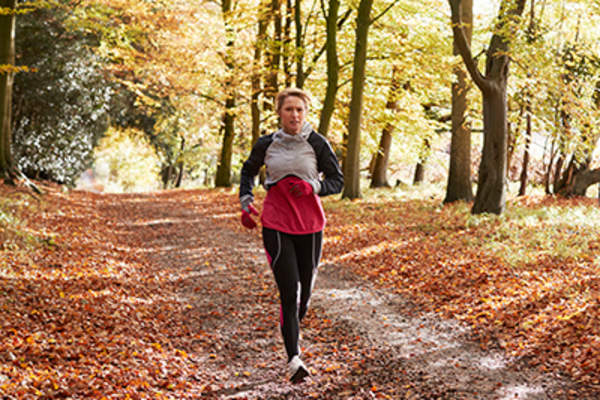 Woman on a run in Autumn.