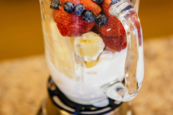 Fruit and yogurt smoothie in blender.