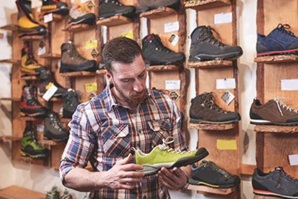 Man shopping for new running shoes