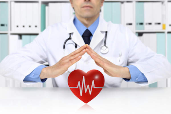 Doctor protecting heart, good health concept.