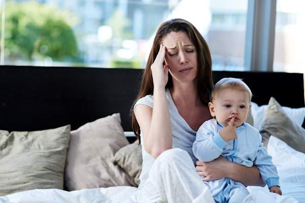 Mother with a migraine
