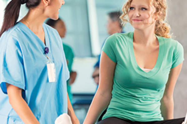 teen talking to physical therapist image