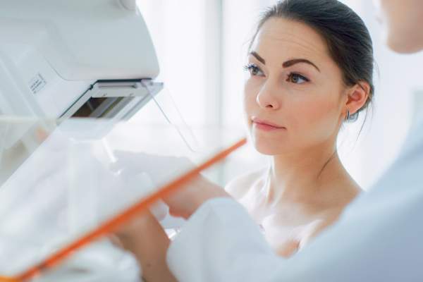 In the Hospital, Portrait Shot of Topless Female Patient Undergoing Mammogram Screening Procedure