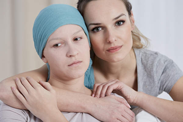 Young woman supporting her friend with cancer.