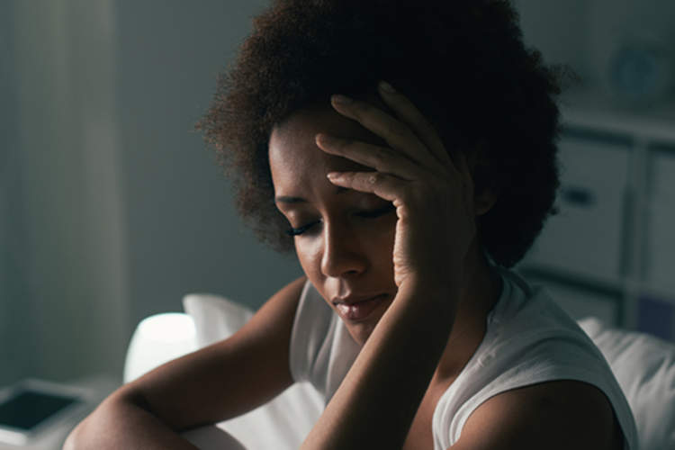 Woman with migraine headache.