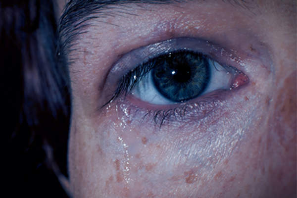 Close up of eye with tears.