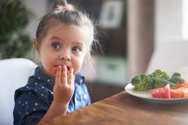 Child eating vegetables