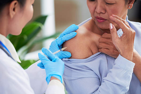 Patient getting a vaccine.