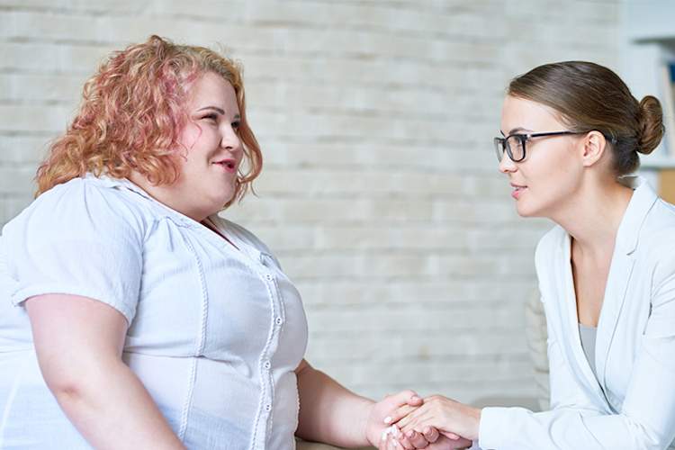 Obese woman getting counseling before weight loss surgery.