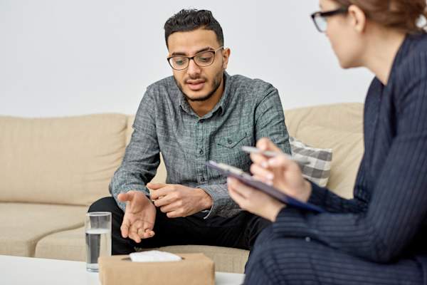 Man talking to a psychiatrist.